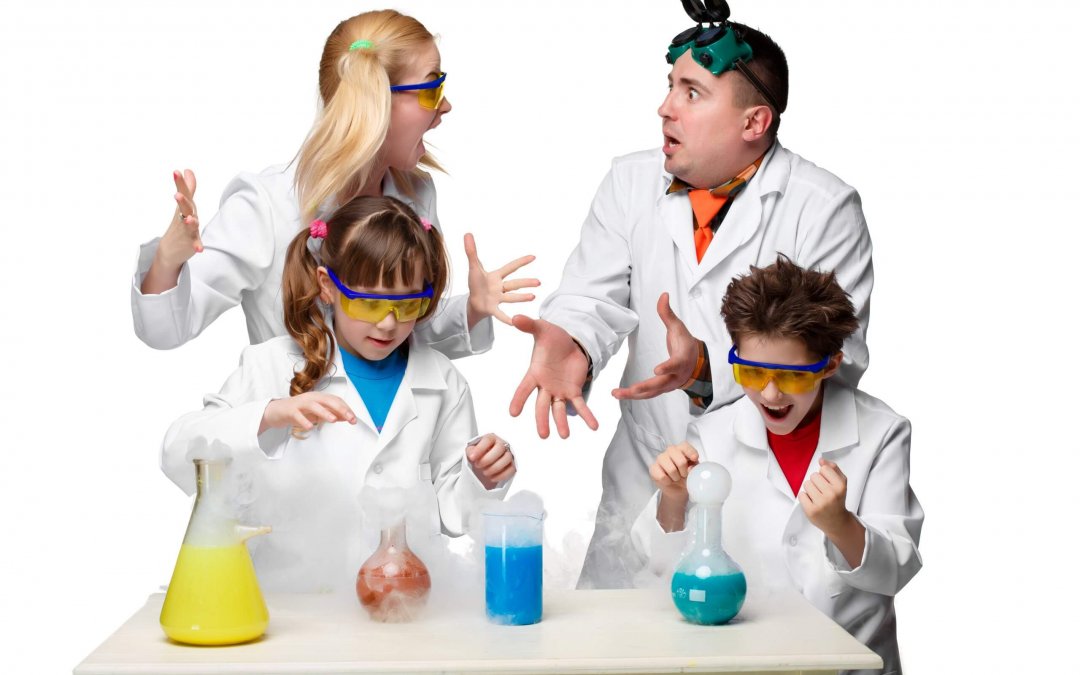 Teens and teachers of chemistry at  lesson making experiments